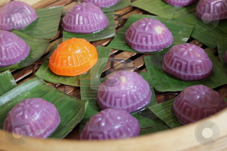 To use this stock image in your creative project, please select the size you need over to the right and click the "Add to Cart" button.
Your downloaded image will come with the Cutcaster watermark removed so don’t worry about the watermark you see on this page. Ang-ku Cakes stock photo, A Chinese gelatinous rice cake. Inside each cake is filled with sweet bean paste and the cakes are steamed in a bamboo tray. by Ah Hock Ong