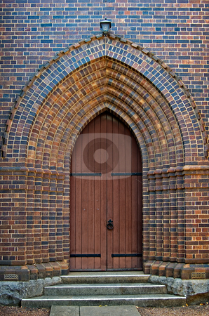 To use this stock image in your creative project, please select the size you need over to the right and click the "Add to Cart" button.
Your downloaded image will come with the Cutcaster watermark removed so don’t worry about the watermark you see on this page. Arched church doorway stock photo, An arched brick doorway with wooden door leading into the church by Phil Morley