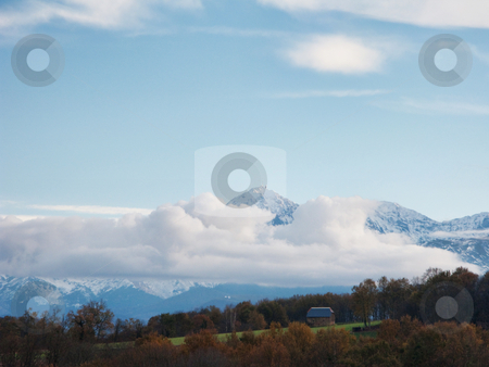 To use this stock image in your creative project, please select the size you need over to the right and click the "Add to Cart" button.
Your downloaded image will come with the Cutcaster watermark removed so don’t worry about the watermark you see on this page. Mountain landscape stock photo, Pyrenees mountains range in clouds with field in the foreground by Laurent Dambies