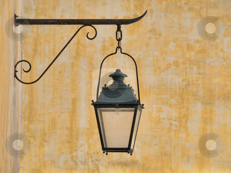 To use this stock image in your creative project, please select the size you need over to the right and click the "Add to Cart" button.
Your downloaded image will come with the Cutcaster watermark removed so don’t worry about the watermark you see on this page. Vintage lamp stock photo, Wall mounted vintage lamp with yellow background by Laurent Dambies