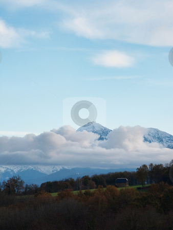 To use this stock image in your creative project, please select the size you need over to the right and click the "Add to Cart" button.
Your downloaded image will come with the Cutcaster watermark removed so don’t worry about the watermark you see on this page. Mountain landscape stock photo, Pyrenees mountains range in clouds with field in the foreground by Laurent Dambies