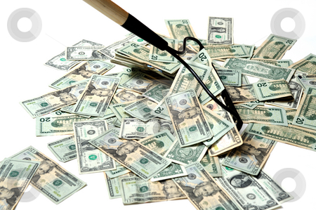 To use this stock image in your creative project, please select the size you need over to the right and click the "Add to Cart" button.
Your downloaded image will come with the Cutcaster watermark removed so don’t worry about the watermark you see on this page. Raking In The Cash stock photo, United States twenty dollar bills insolated on a white background being raked up with a garden rake to show the concept of making money easy by Lynn Bendickson