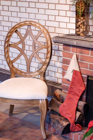 To use this stock image in your creative project, please select the size you need over to the right and click the "Add to Cart" button.
Your downloaded image will come with the Cutcaster watermark removed so don’t worry about the watermark you see on this page. Stocking On Fireplace stock photo, A Christmas stocking hung by the fireplace with a wooden chair beside it by Richard Nelson