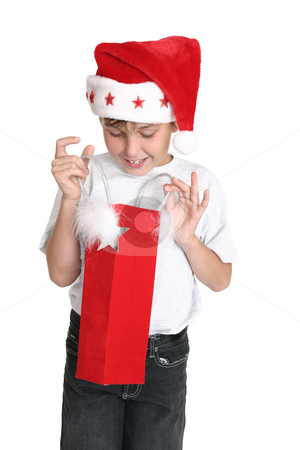 To use this stock image in your creative project, please select the size you need over to the right and click the "Add to Cart" button.
Your downloaded image will come with the Cutcaster watermark removed so don’t worry about the watermark you see on this page. Opening a Christmas Gift stock photo, A delighted young boy looks inside a gift bag by Leah-Anne Thompson