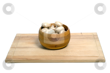 To use this stock image in your creative project, please select the size you need over to the right and click the "Add to Cart" button.
Your downloaded image will come with the Cutcaster watermark removed so don’t worry about the watermark you see on this page. Bowl Of Mushrooms stock photo, A wooden bowl of aged mushrooms shot on a wood cutting board, isolated against a white background by Richard Nelson