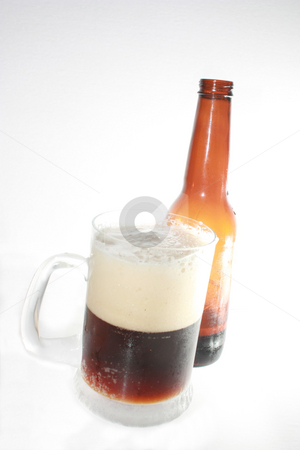 To use this stock image in your creative project, please select the size you need over to the right and click the "Add to Cart" button.
Your downloaded image will come with the Cutcaster watermark removed so don’t worry about the watermark you see on this page. Root Beer stock photo, A frosty mug of root beer, and a bottle, isolated against white by Rob Wright