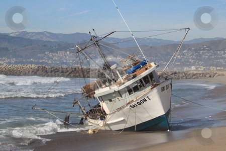 To use this stock image in your creative project, please select the size you need over to the right and click the "Add to Cart" button.
Your downloaded image will come with the Cutcaster watermark removed so don’t worry about the watermark you see on this page. Fishing Boat Rescue stock photo, VENTURA, CA, USA - January 8, 2010 - The fishing boat SAI GON I ran aground after 4 people were rescued early morning. The rescue team tried to free the boat throughout the day January 8, 2010 in Ventura, CA by Henrik Lehnerer