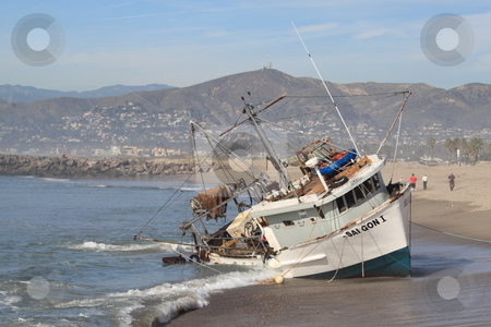 To use this stock image in your creative project, please select the size you need over to the right and click the "Add to Cart" button.
Your downloaded image will come with the Cutcaster watermark removed so don’t worry about the watermark you see on this page. Fishing Boat Rescue stock photo, VENTURA, CA, USA - January 8, 2010 - The fishing boat SAI GON I ran aground after 4 people were rescued early morning. The rescue team tried to free the boat throughout the day January 8, 2010 in Ventura, CA by Henrik Lehnerer