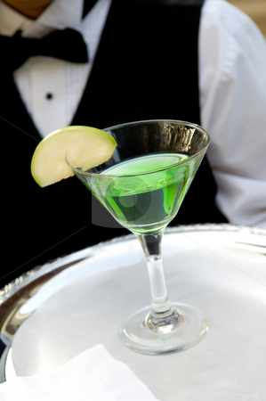 To use this stock image in your creative project, please select the size you need over to the right and click the "Add to Cart" button.
Your downloaded image will come with the Cutcaster watermark removed so don’t worry about the watermark you see on this page. Bright green apple martini stock photo, An image of a bright green apple martini by Greg Blomberg