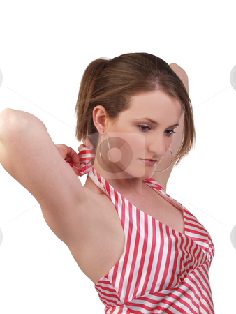 To use this stock image in your creative project, please select the size you need over to the right and click the "Add to Cart" button.
Your downloaded image will come with the Cutcaster watermark removed so don’t worry about the watermark you see on this page. Young blond woman untieing red and white top stock photo, Young caucasian woman preparing to undo tie on blouse by Jeff Cleveland