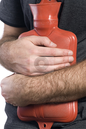 To use this stock image in your creative project, please select the size you need over to the right and click the "Add to Cart" button.
Your downloaded image will come with the Cutcaster watermark removed so don’t worry about the watermark you see on this page. Stomach Flu stock photo, Close-up view of somebody holding a hot water bottle to soothe their sore stomach by Richard Nelson