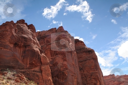 To use this stock image in your creative project, please select the size you need over to the right and click the "Add to Cart" button.
Your downloaded image will come with the Cutcaster watermark removed so don’t worry about the watermark you see on this page. Blue sky over desert cliffs stock photo, Blue skies on a sunny day in southern Utah's desert by Greg Peterson