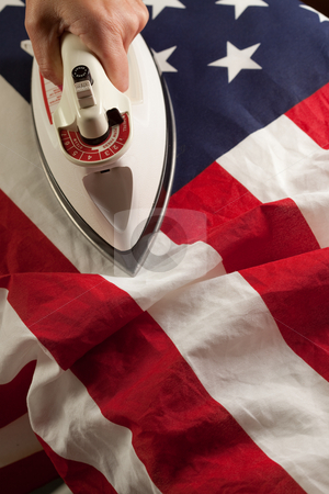 To use this stock image in your creative project, please select the size you need over to the right and click the "Add to Cart" button.
Your downloaded image will come with the Cutcaster watermark removed so don’t worry about the watermark you see on this page. Ironing Out the Wrinkles of Flag stock photo, Ironing Out the Wrinkles in the American Flag - Conceptual. by Andy Dean
