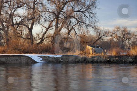 To use this stock image in your creative project, please select the size you need over to the right and click the "Add to Cart" button.
Your downloaded image will come with the Cutcaster watermark removed so don’t worry about the watermark you see on this page. Blind for waterfowl hunting stock photo, Old blind for waterfowl hunting on shore of South Platte River, Colorado near Greeley, winter scenery with cottonwoods and some snow by Marek Uliasz
