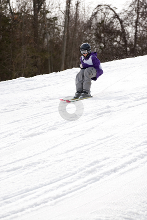 To use this stock image in your creative project, please select the size you need over to the right and click the "Add to Cart" button.
Your downloaded image will come with the Cutcaster watermark removed so don’t worry about the watermark you see on this page. Youth Freestyle Skiing stock photo, A youth freestyle skier skiing down the mountain without any ski poles. by Todd Arena