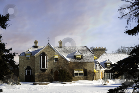 To use this stock image in your creative project, please select the size you need over to the right and click the "Add to Cart" button.
Your downloaded image will come with the Cutcaster watermark removed so don’t worry about the watermark you see on this page. Mansion stock photo, A large mansion in the winter framed by large evergreen trees. by Richard Nelson