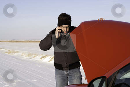 To use this stock image in your creative project, please select the size you need over to the right and click the "Add to Cart" button.
Your downloaded image will come with the Cutcaster watermark removed so don’t worry about the watermark you see on this page. Checking Under The Hood stock photo, A young man is checking under the car hood while talking on a cell phone. by Richard Nelson