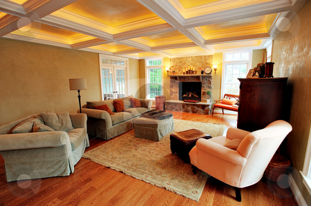 To use this stock image in your creative project, please select the size you need over to the right and click the "Add to Cart" button.
Your downloaded image will come with the Cutcaster watermark removed so don’t worry about the watermark you see on this page. Upscale Living Room Interior stock photo, View of an upscale living room interior with a box beam ceiling. Horizontal format. by Christopher Nuzzaco
