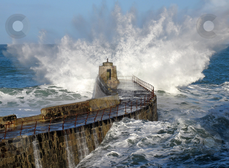 To use this stock image in your creative project, please select the size you need over to the right and click the "Add to Cart" button.
Your downloaded image will come with the Cutcaster watermark removed so don’t worry about the watermark you see on this page. Big wave splash on Portreath pier, Cornwall UK. stock photo, Big wave splash on Portreath pier, Cornwall UK. by Stephen Rees