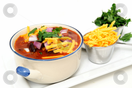 To use this stock image in your creative project, please select the size you need over to the right and click the "Add to Cart" button.
Your downloaded image will come with the Cutcaster watermark removed so don’t worry about the watermark you see on this page. Chili And Beans stock photo, Chili and beans in a ceramic bowl with onion, cilantro and cheddar cheese sprinkled on with with sides of each in stainless steel condiment cups. by Lynn Bendickson