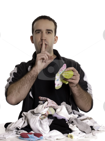To use this stock image in your creative project, please select the size you need over to the right and click the "Add to Cart" button.
Your downloaded image will come with the Cutcaster watermark removed so don’t worry about the watermark you see on this page. Man Matching Mixed Socks stock photo, A young man matching socks that don't go together and saying shhh. by Richard Nelson