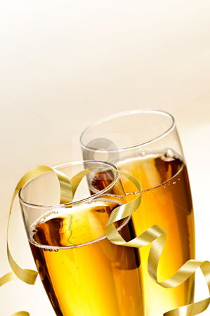 To use this stock image in your creative project, please select the size you need over to the right and click the "Add to Cart" button.
Your downloaded image will come with the Cutcaster watermark removed so don’t worry about the watermark you see on this page. Champagne glasses stock photo, Two full champagne flutes with sparkling wine and ribbon by Elena Elisseeva