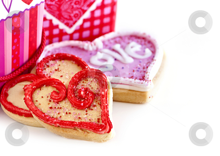 To use this stock image in your creative project, please select the size you need over to the right and click the "Add to Cart" button.
Your downloaded image will come with the Cutcaster watermark removed so don’t worry about the watermark you see on this page. Valentines cookies stock photo, Homemade baked shortbread Valentine cookies with icing and gift boxes by Elena Elisseeva