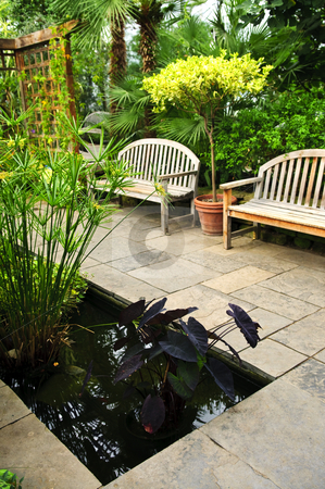 To use this stock image in your creative project, please select the size you need over to the right and click the "Add to Cart" button.
Your downloaded image will come with the Cutcaster watermark removed so don’t worry about the watermark you see on this page. Lush green garden stock photo, Lush green garden with stone landscaping, pond and benches by Elena Elisseeva