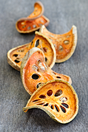 To use this stock image in your creative project, please select the size you need over to the right and click the "Add to Cart" button.
Your downloaded image will come with the Cutcaster watermark removed so don’t worry about the watermark you see on this page. Dried bael fruit stock photo, Slices of dried bael fruit on wood surface by Elena Elisseeva