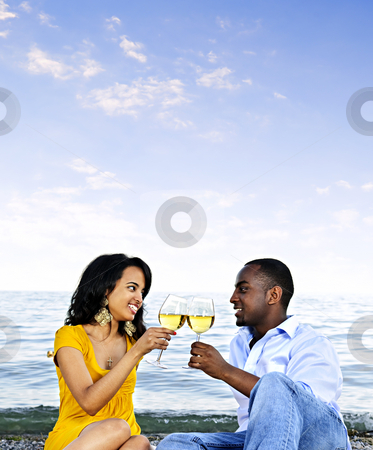 To use this stock image in your creative project, please select the size you need over to the right and click the "Add to Cart" button.
Your downloaded image will come with the Cutcaster watermark removed so don’t worry about the watermark you see on this page. Happy couple having wine on beach stock photo, Young romantic couple celebrating with wine at the beach with copyspace by Elena Elisseeva