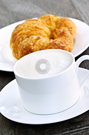 To use this stock image in your creative project, please select the size you need over to the right and click the "Add to Cart" button.
Your downloaded image will come with the Cutcaster watermark removed so don’t worry about the watermark you see on this page. Latte coffee and croissant stock photo, Latte coffee with frothed milk and fresh croissant by Elena Elisseeva