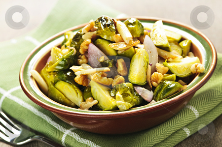 To use this stock image in your creative project, please select the size you need over to the right and click the "Add to Cart" button.
Your downloaded image will come with the Cutcaster watermark removed so don’t worry about the watermark you see on this page. Roasted brussels sprouts dish stock photo, Vegetarian bowl of roasted brussels sprouts with walnuts by Elena Elisseeva