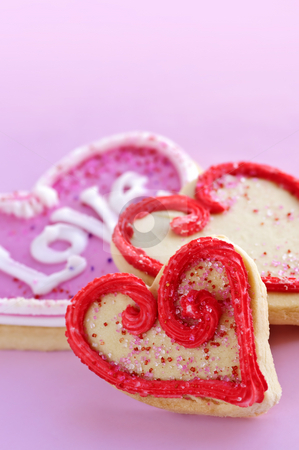 To use this stock image in your creative project, please select the size you need over to the right and click the "Add to Cart" button.
Your downloaded image will come with the Cutcaster watermark removed so don’t worry about the watermark you see on this page. Valentines cookies stock photo, Homemade baked shortbread Valentine cookies with icing on pink background by Elena Elisseeva