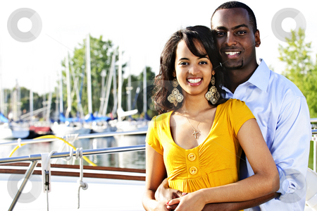 To use this stock image in your creative project, please select the size you need over to the right and click the "Add to Cart" button.
Your downloaded image will come with the Cutcaster watermark removed so don’t worry about the watermark you see on this page. Happy couple at seaside stock photo, Young romantic couple hugging and standing at harbor by Elena Elisseeva