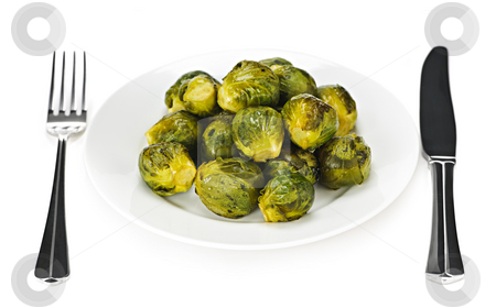 To use this stock image in your creative project, please select the size you need over to the right and click the "Add to Cart" button.
Your downloaded image will come with the Cutcaster watermark removed so don’t worry about the watermark you see on this page. Plate of brussels sprouts stock photo, Plate of roasted green brussels sprouts with knife and fork isolated on white by Elena Elisseeva