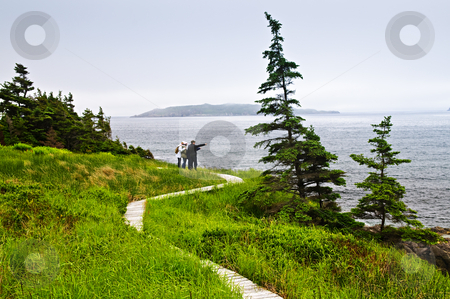 To use this stock image in your creative project, please select the size you need over to the right and click the "Add to Cart" button.
Your downloaded image will come with the Cutcaster watermark removed so don’t worry about the watermark you see on this page. Father and children at Atlantic coast in Newfoundland stock photo, Father and children standing at Atlantic shore in Newfoundland, Canada by Elena Elisseeva
