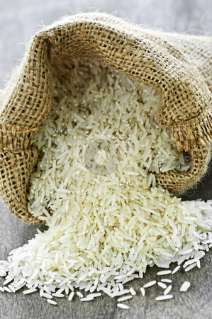 To use this stock image in your creative project, please select the size you need over to the right and click the "Add to Cart" button.
Your downloaded image will come with the Cutcaster watermark removed so don’t worry about the watermark you see on this page. Long grain rice in burlap sack stock photo, Raw long grain white rice grains in burlap bag by Elena Elisseeva