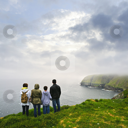 To use this stock image in your creative project, please select the size you need over to the right and click the "Add to Cart" button.
Your downloaded image will come with the Cutcaster watermark removed so don’t worry about the watermark you see on this page. Family visiting Cape St. Mary's Ecological Bird Sanctuary in Newfoundland stock photo, Family looking from cliff at Cape St. Mary's Ecological Bird Sanctuary in Newfoundland, Canada by Elena Elisseeva