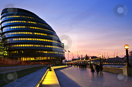 To use this stock image in your creative project, please select the size you need over to the right and click the "Add to Cart" button.
Your downloaded image will come with the Cutcaster watermark removed so don’t worry about the watermark you see on this page. London city hall at night stock photo, New London city hall at night with pedestrians on sidewalk by Elena Elisseeva