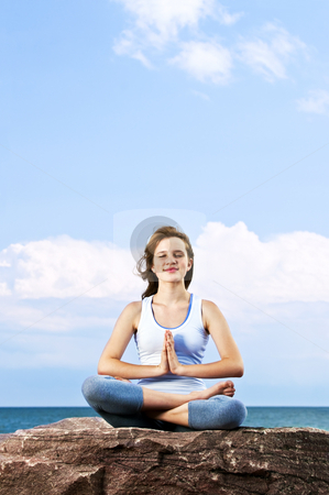 To use this stock image in your creative project, please select the size you need over to the right and click the "Add to Cart" button.
Your downloaded image will come with the Cutcaster watermark removed so don’t worry about the watermark you see on this page. Young girl meditating outdoors stock photo, Portrait of young teenage girl practicing yoga outside by Elena Elisseeva