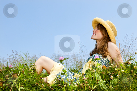 To use this stock image in your creative project, please select the size you need over to the right and click the "Add to Cart" button.
Your downloaded image will come with the Cutcaster watermark removed so don’t worry about the watermark you see on this page. Young girl sitting in meadow stock photo, Young teenage girl sitting on summer meadow in straw hat by Elena Elisseeva
