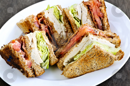 To use this stock image in your creative project, please select the size you need over to the right and click the "Add to Cart" button.
Your downloaded image will come with the Cutcaster watermark removed so don’t worry about the watermark you see on this page. Club sandwich stock photo, Toasted club sandwich sliced on a plate by Elena Elisseeva