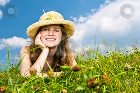 To use this stock image in your creative project, please select the size you need over to the right and click the "Add to Cart" button.
Your downloaded image will come with the Cutcaster watermark removed so don’t worry about the watermark you see on this page. Young girl laying in meadow stock photo, Young teenage girl laying in summer meadow resting chin on hand in straw hat by Elena Elisseeva