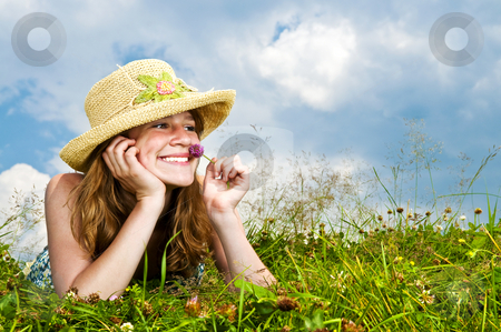 To use this stock image in your creative project, please select the size you need over to the right and click the "Add to Cart" button.
Your downloaded image will come with the Cutcaster watermark removed so don’t worry about the watermark you see on this page. Young girl laying in meadow stock photo, Young teenage girl laying in summer meadow resting chin on hand smelling flower by Elena Elisseeva