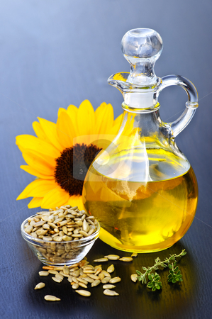 To use this stock image in your creative project, please select the size you need over to the right and click the "Add to Cart" button.
Your downloaded image will come with the Cutcaster watermark removed so don’t worry about the watermark you see on this page. Sunflower oil bottle stock photo, Sunflower oil bottle with raw seeds and flower by Elena Elisseeva