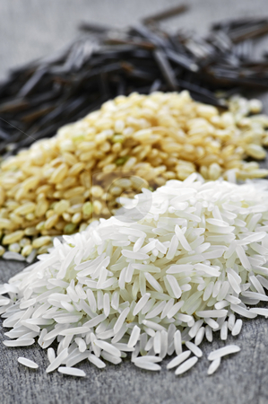To use this stock image in your creative project, please select the size you need over to the right and click the "Add to Cart" button.
Your downloaded image will come with the Cutcaster watermark removed so don’t worry about the watermark you see on this page. Three piles of rice stock photo, Three piles of white, brown and wild black uncooked rice by Elena Elisseeva