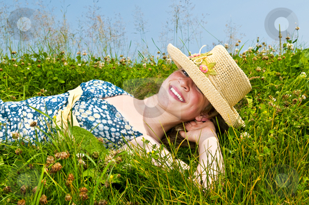 To use this stock image in your creative project, please select the size you need over to the right and click the "Add to Cart" button.
Your downloaded image will come with the Cutcaster watermark removed so don’t worry about the watermark you see on this page. Young girl laying on meadow stock photo, Young teenage girl laying on summer meadow amid wildflowers in straw hat by Elena Elisseeva