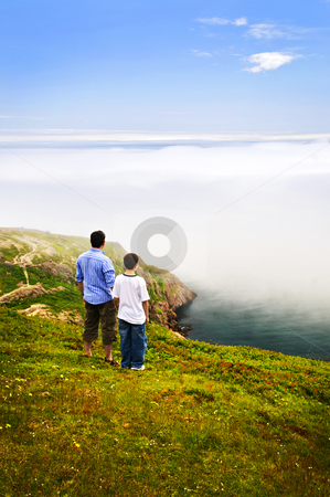 To use this stock image in your creative project, please select the size you need over to the right and click the "Add to Cart" button.
Your downloaded image will come with the Cutcaster watermark removed so don’t worry about the watermark you see on this page. Father and son at ocean coast stock photo, Father and son looking at foggy ocean view in Newfoundland by Elena Elisseeva