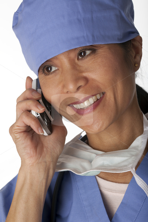 To use this stock image in your creative project, please select the size you need over to the right and click the "Add to Cart" button.
Your downloaded image will come with the Cutcaster watermark removed so don’t worry about the watermark you see on this page. Medical Professional in Scrubs on the Phone stock photo, Closeup, cropped view of an Asian female medical professional wearing scrubs and talking on a cell phone. Vertical shot. Isolated on white. by Edward Bock