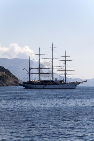 To use this stock image in your creative project, please select the size you need over to the right and click the "Add to Cart" button.
Your downloaded image will come with the Cutcaster watermark removed so don’t worry about the watermark you see on this page. Pirate Ship stock photo, A lone pirate ship out on the blue seas by Kevin Tietz